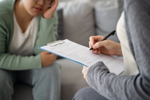 Psychologist examine and listen and talk to patient with depression, anxiety photo