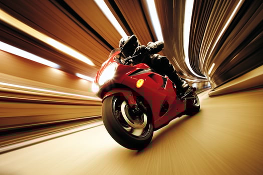 A person riding a motorcycle through a tunnel photo