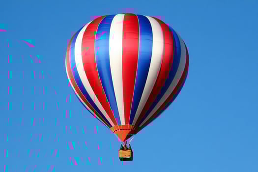 A red, white and blue hot air balloon photo