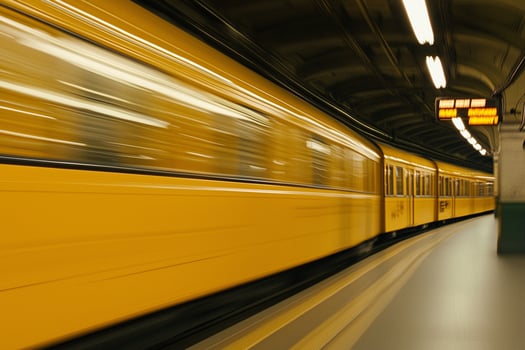 A train is moving through a station photo