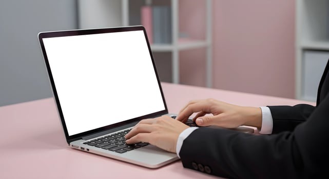 Laptop Typing on Desk with Blank Screen photo