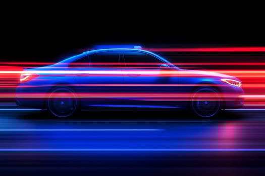 A car driving on a road with red and blue lights photo