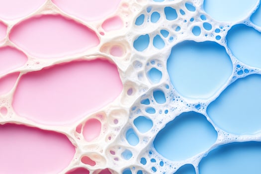 Soap bubbles on pink and blue background photo