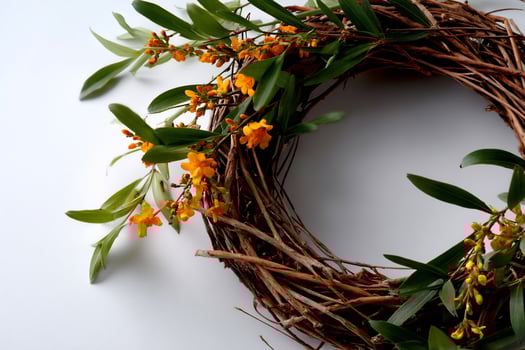 Rustic wreath with vibrant yellow blossoms photo