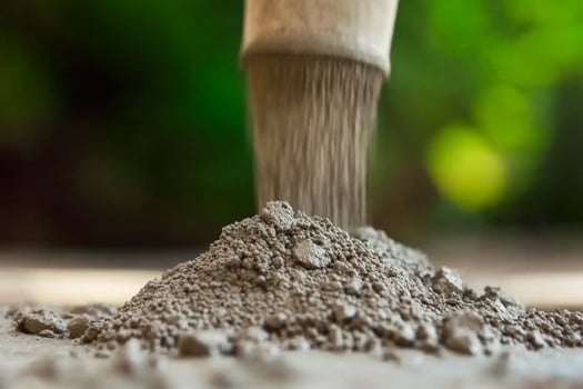 A shovel is being used to mix cement photo