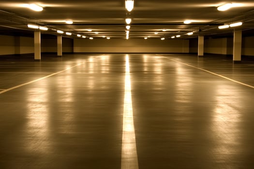 Empty parking garage with lights on photo