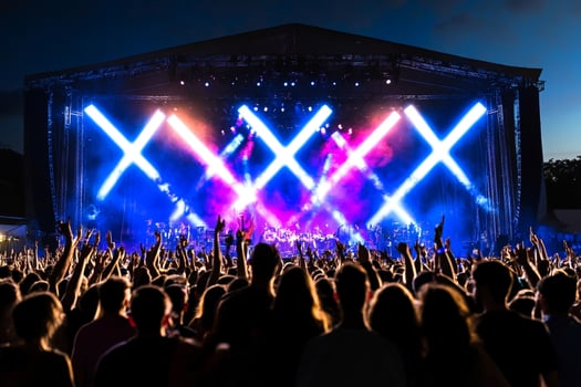 A crowd at a concert with bright lights photo