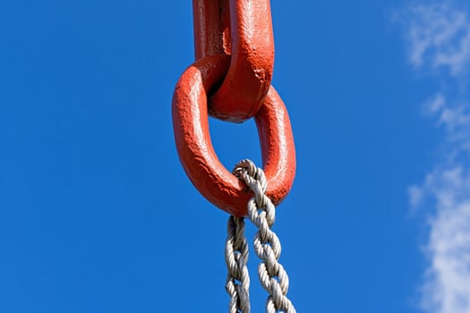 A red chain attached to a red hook photo