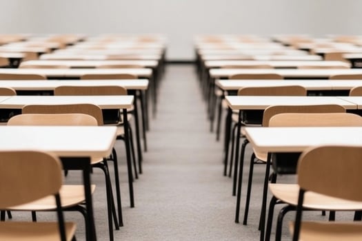 Empty classroom with rows of desks and chairs photo