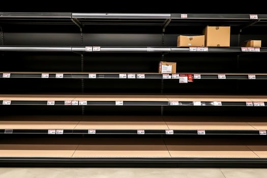 Empty shelves in a supermarket photo