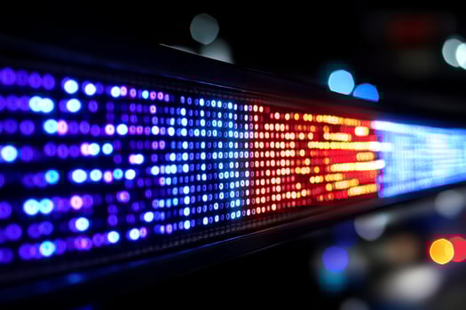 A close up of a colorful led strip on a wall photo