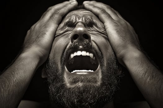 A man with his hands on his head photo