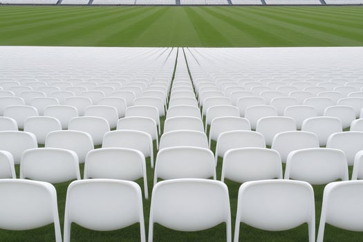 A row of white chairs photo