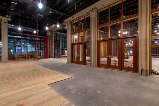 A large room with wooden floors and windows photo
