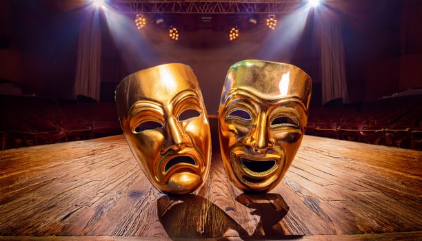 Two golden masks, one laughing, one weeping, rest on the timeworn wooden stage floor silent witnesses to countless performances and the raw emotion of theaters timeless expression. photo