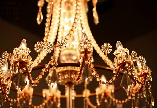 gold chandelier with crystal beads hanging from it photo