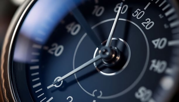 close up of a clock with a blue face photo