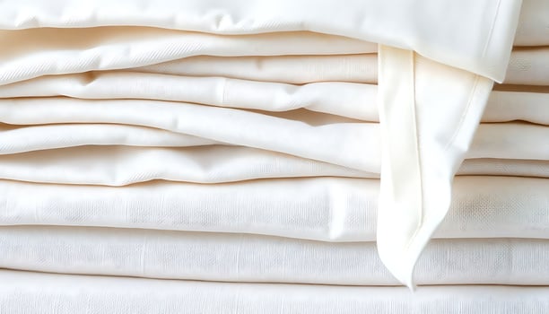 stack of white sheets folded neatly on top of each other photo
