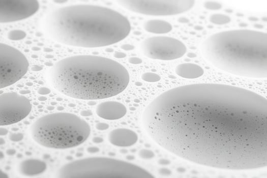 A close up of bubbles in a white surface photo