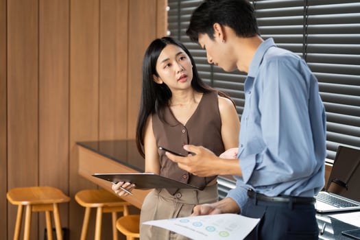 Business Presentation and Strategy. Professionals reviewing data and reports in a modern office. photo