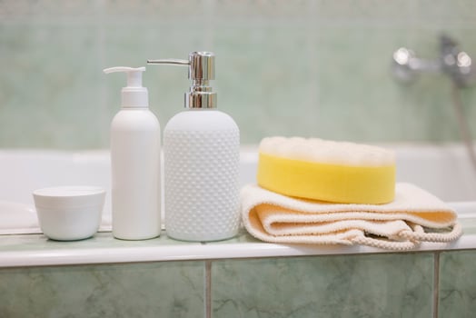 bath accessories liquid soap dispenser with washcloth and cream photo