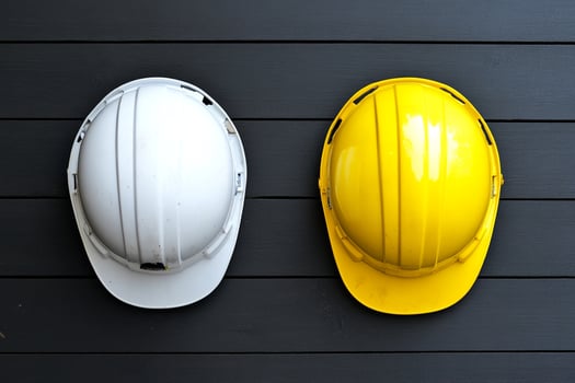 Two hard hats on a black background photo