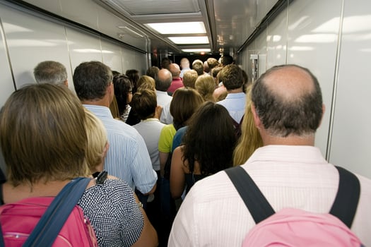 A crowd of people in a train photo