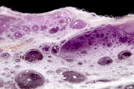 A close up of a purple soap bubble photo