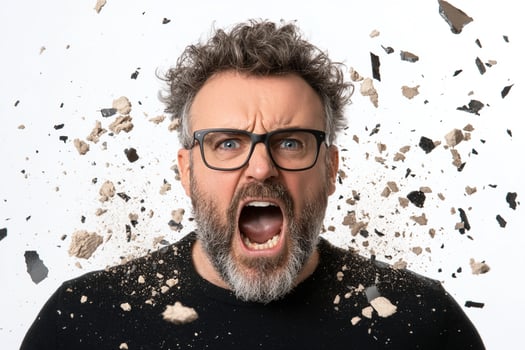 A man with glasses and a beard is screaming photo