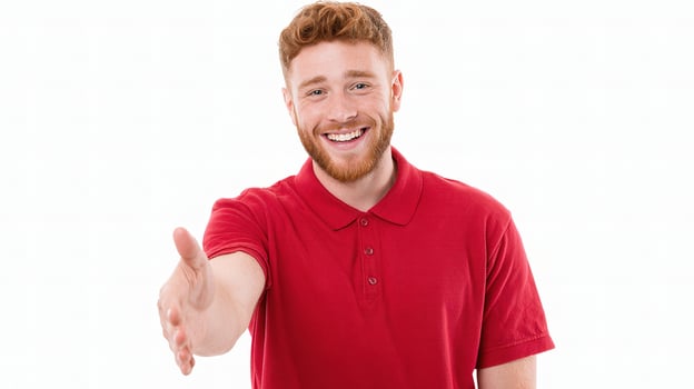 A man in a red shirt is giving a thumbs up photo
