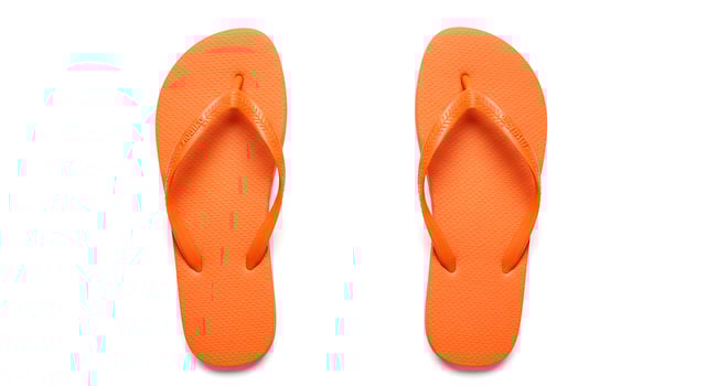 Top view of casual summer flip flops on white background for use in seasonal catalog layouts beachwear blogs and minimalist product designs photo
