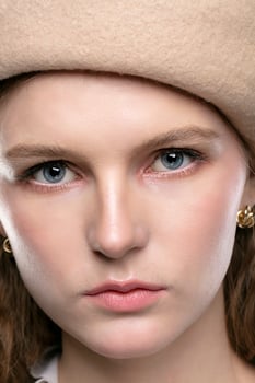 Beautiful girl in a beret close-up. photo