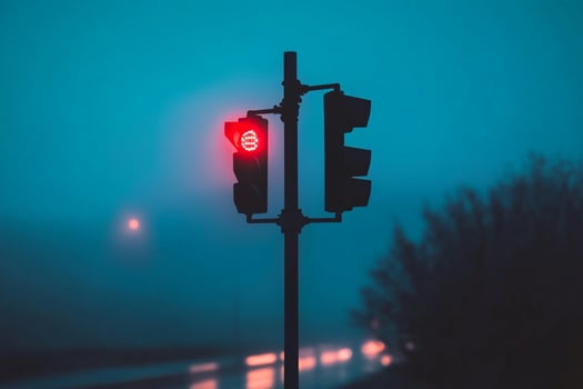 Traffic light in fog photo