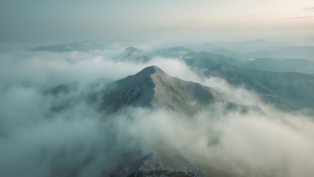 Misty Mountain Peak View A Serene Landscape of Hills and Clouds, Early Morning photo
