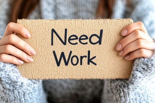 Need work sign in hands of woman photo