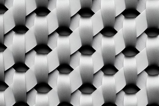 A black and white photo of a patterned fabric