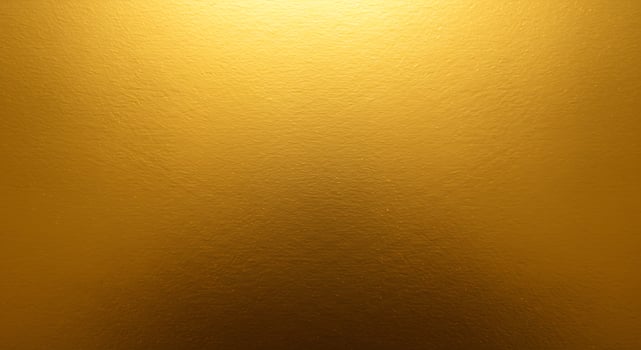 Golden metallic texture background with a light shine photo