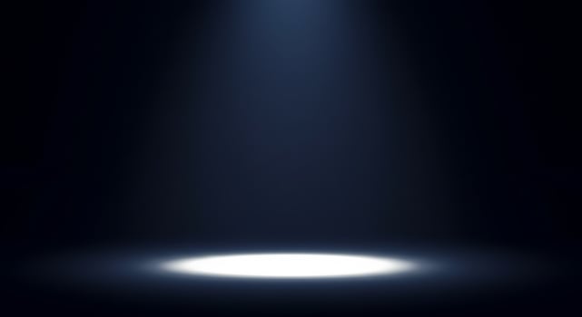 A spotlight is shining on a dark background photo