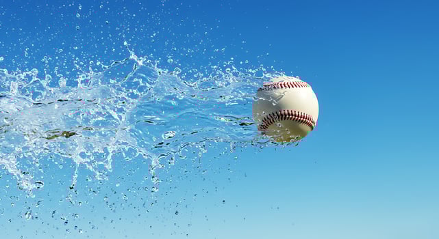 A baseball is splashing into the water photo