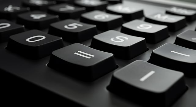A close up of a black calculator with numbers on it photo