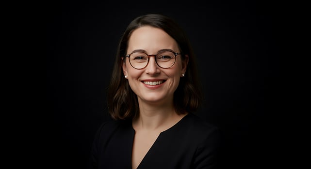 A woman with glasses and a black shirt photo
