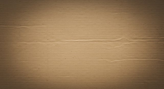 A brown cardboard background with some scratches photo