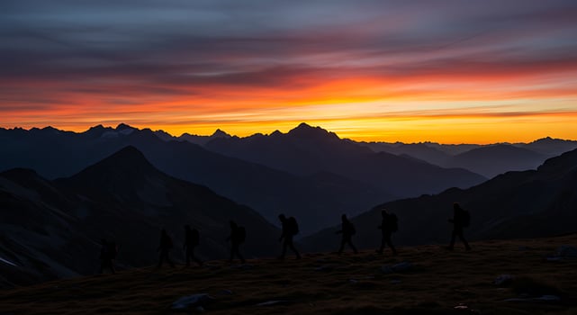 A group of people walking on a mountain photo