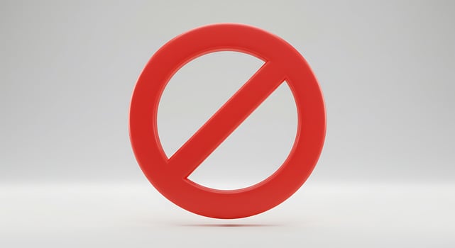 A red no entry sign on a white background photo