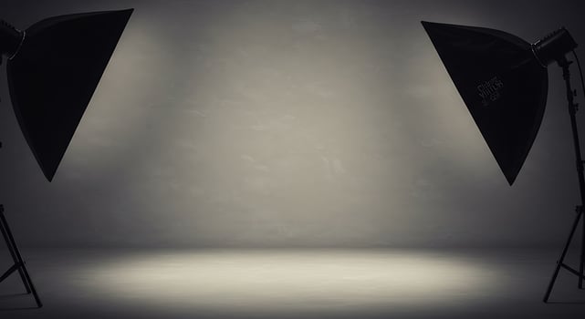 Photo studio with two lights and a white wall