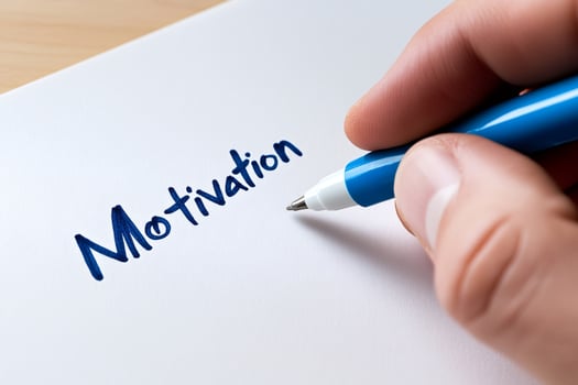 Businessman writing motivation on a white paper with blue pen photo