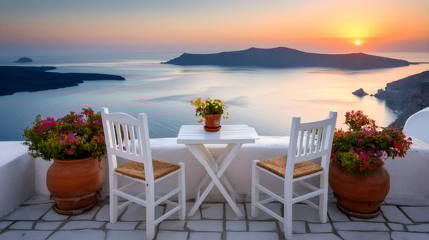 Romantic dinner setting overlooking the aegean sea at sunset in santorini photo