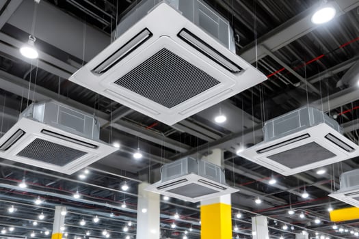 Modern air conditioners cooling a large industrial building photo