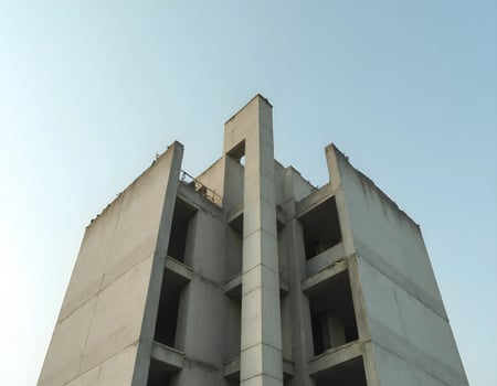 Unfinished Concrete Building Under Blue Sky photo