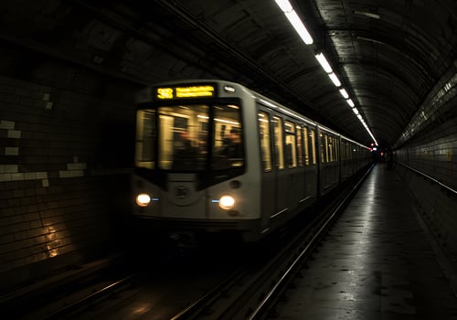 Subway train in underground tunnel photo